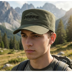Close-up of military green flat top cap with corps expedition embroidery in the forest