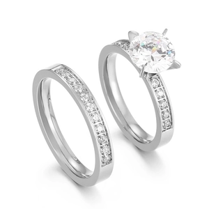Elegant six-prong solitaire cubic zirconia ring set with matching half-eternity band