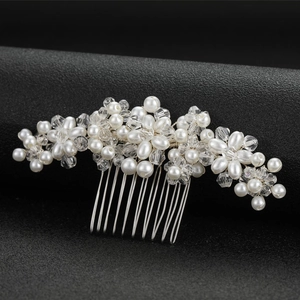 Elegant bridal hair comb with pearls and crystals on a silver metal base floral design