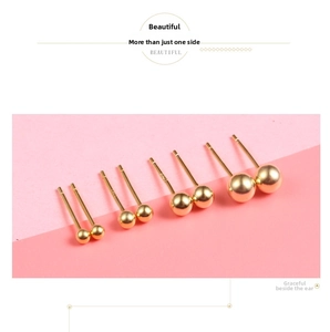 Detailed view of four pairs of gold S925 sterling silver ball studs in various sizes
