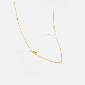 Close-up of polished S925 silver letter B pendant necklace with zircon accents
