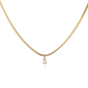 Gold herringbone snake chain necklace with a micro-paved letter S pendant on white surface