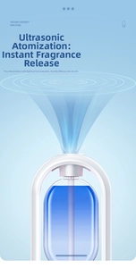 Detail of ultrasonic aromatherapy diffuser showing fine mist from blue reservoir