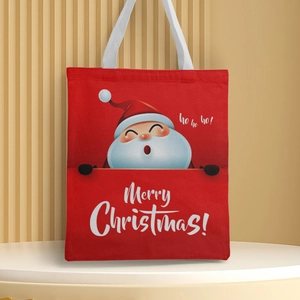 Detail of red Christmas canvas tote bag featuring Santa Claus print and Merry Christmas text