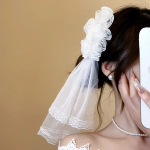 Elegant white lace Lolita headpiece with layered mesh veil and delicate ruffled trim detail