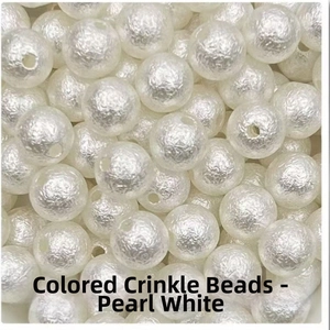 Macro shot of pearl white wrinkled ABS beads with textured surface for DIY jewelry making