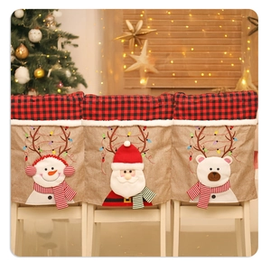 Detail of burlap Christmas chair covers with 3D Santa, Snowman and Bear characters