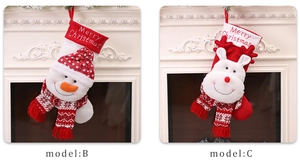 Detail of Christmas stockings with snowman and reindeer designs on a festive mantel