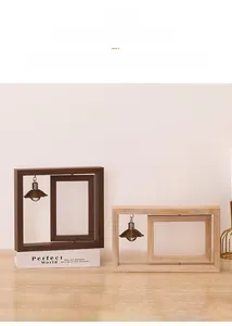 Rotating double-sided wooden photo frame with heart pendant and warm decorative lights