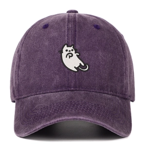 Detailed view of white cartoon cat embroidery on washed vintage purple baseball cap