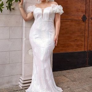 Detail of white sequin fisheye gown with mesh V-neck and tiered ruffle off-shoulder sleeves