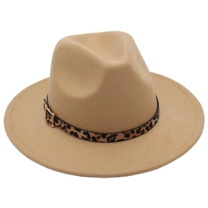 Detail of camel fedora hat featuring leopard print band and golden metal buckle