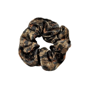 Glossy black scrunchie with metallic gold leopard pattern for elegant hairstyles