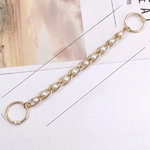Macro shot of 240mm golden pearl chain accessory with spring rings and detailed dimensions