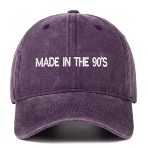 Detail view of MADE IN THE 90'S white embroidery on vintage washed purple cotton baseball cap