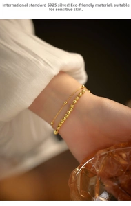 Detailed close-up of double-layer S925 sterling silver beaded bracelet on a wrist
