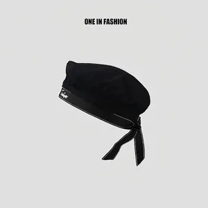 Japanese style black cotton beret with white embroidery and ribbon bow tie back