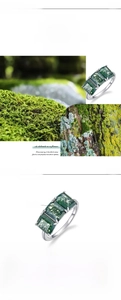 Macro shot of S925 silver ring featuring three rectangular green moss agate stones
