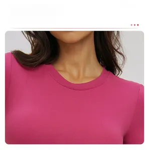 Close-up of slim-fit rose red yoga T-shirt showing round neckline and knit texture