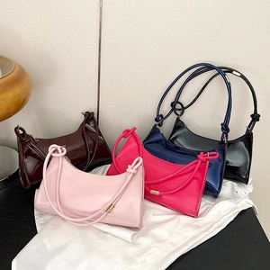 Stylish patent leather baguette bags in five colors with decorative knot straps