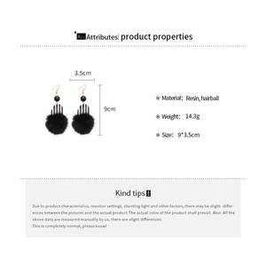 Detail showing dimensions of retro resin drop earrings with black hairballs and stripes