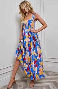 Detailed close-up of the bohemian floral print fabric and smocked bodice on a maxi dress