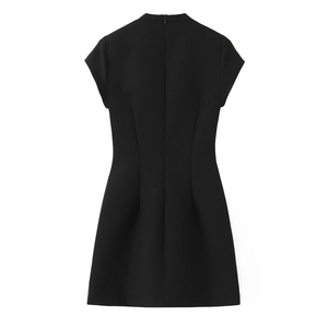 Detailed back view of a slim-fit black polka dot mini dress with hidden zipper and high collar