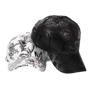 Baroque floral print baseball caps in black and white with metallic glossy finish