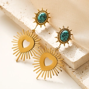 Vintage gold sunburst earrings with turquoise stone and heart detail on stone base