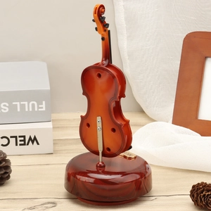 Vintage violin musical box with rotating base in reddish brown wood grain finish