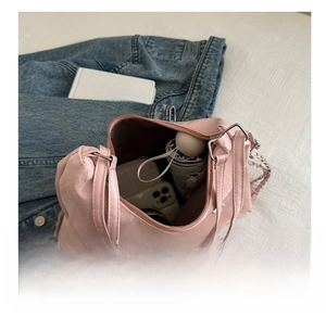 Pink nylon shoulder bag with large capacity showing umbrella and phone inside