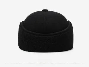 Close-up of a black winter wool docker hat with warm sherpa fleece lining and textures