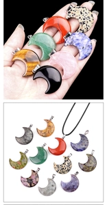 Macro shot of 30mm crescent moon pendants in various natural stones with metal bails