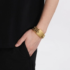 Close-up of a 23mm golden double-row braided stainless steel bracelet with a box clasp