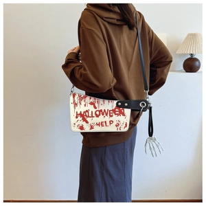 Back view of model wearing a bloody cleaver crossbody bag with Halloween Help print