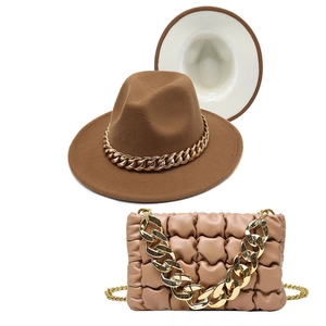 Matching set of brown fedora hat with gold chain and beige quilted chain handbag