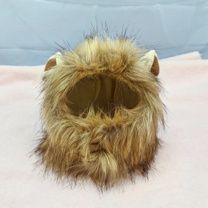 Detail view of lion mane pet wig with plush round ears and faux fur texture for cats