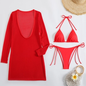 Detailed flat lay of a red three-piece bikini set including a long-sleeve mesh cover-up