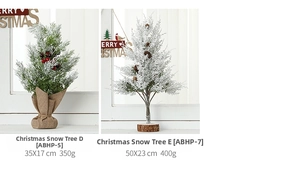 Miniature snow-covered pine trees with burlap and wood bases for Christmas decor