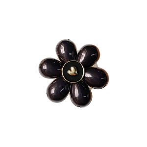 Black floral phone stand with golden heart center on a clean white background