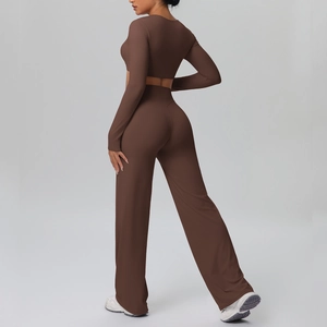 Detail view of brown long-sleeve yoga set with high-waist wide-leg pants on a model