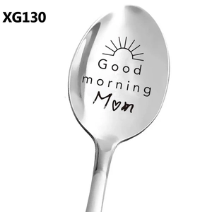 Macro view of polished stainless steel spoon engraved with Good morning Mom and sun icon