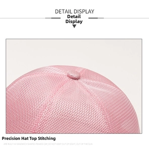 Detail view of pink breathable mesh top and stitching on a minimalist docker cap
