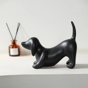 Minimalist matte black dachshund ceramic sculpture for modern home shelf and desk decor