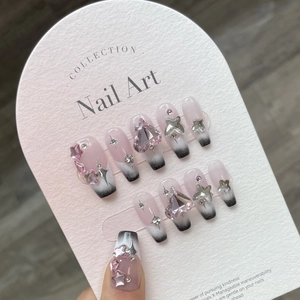 Pink and black Y2K French press-on nails with 3D hearts, stars and sparkling crystals