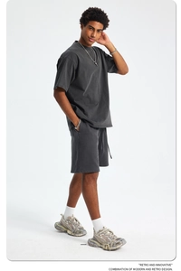 Detailed view of dark grey washed cotton oversized t-shirt and shorts set with retro texture