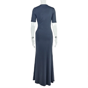 Detail view of the back of a slim fit dark blue maxi dress with side waist ruching