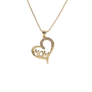 Detail of gold heart pendant with MOM engraving and zircon accents on a fine chain