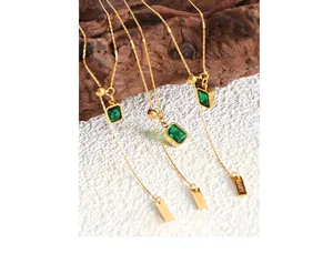 Detailed view of emerald green zircon square pendant necklaces with adjustable gold chains
