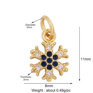 Detail view of mini gold-plated snowflake pendant with blue stones and dimensions